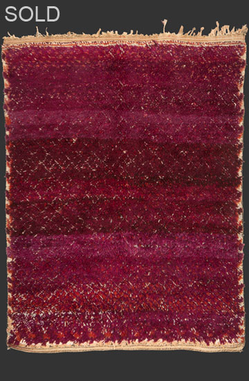 TM 2284, Ait Youssi pile rug with a small pattern diamond grid drawing in a half relief technique, a spectacular abrash in the mauve / purple hues + some white + brick red hints shimmering through ...more